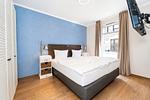 Schlafzimmer mit Doppelbett - Wohnung 01 - Top-Hundeurlaub
