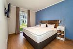 Schlafzimmer mit Doppelbett - Wohnung 09 - Top-Hundeurlaub