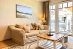 Wohnzimmer mit Blick zum Balkon - Wohnung 39 - Top-Hundeurlaub