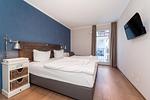 Schlafzimmer mit TV - Wohnung 44 - Top-Hundeurlaub
