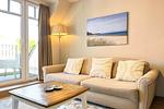 Wohnzimmer mit Sofa - Wohnung 61 - Top-Hundeurlaub