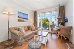 Wohnzimmer mit Blick zur Terrasse - Wohnung 05 - Top-Hundeurlaub