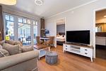 Wohnzimmer mit Blick zur Terrasse - Wohnung 05 - Top-Hundeurlaub