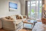 Wohnzimmer mit Blick zum Balkon - Wohnung 48 - Top-Hundeurlaub