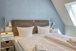 Doppelbett im Schlafzimmer - Wohnung 54 - Top-Hundeurlaub