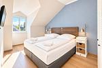 Schlafzimmer mit Doppelbett - Wohnung 64 - Top-Hundeurlaub