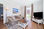 Wohnzimmer mit Blick zur Terrasse - Wohnung 27 - Top-Hundeurlaub
