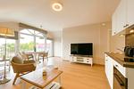 Wohnzimmer mit TV - Wohnung 67 - Top-Hundeurlaub