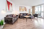 Wohnzimmer mit Blick zur Terrasse - Promenadenvilla 03 Wohnung 04 - Top-Hundeurlaub