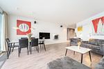 Wohn-und Essbereich mit Blick zum TV - Promenadenvilla 03 Wohnung 07 - Top-Hundeurlaub