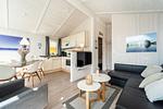 Wohnzimmer mit Blick auf Fernseher - Ferienhaus 14 - Top-Hundeurlaub