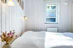1. Schlafzimmer mit Doppelbett - Ferienhaus 18 - Top-Hundeurlaub