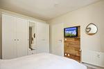 Schlafzimmer mit TV - Wohnung 39 - Top-Hundeurlaub