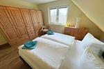 Gemütliches Doppelbett unter charmanten Dachschrägen in Kölpinsee - Ferienwohnung Ostseeblume - Top-Hundeurlaub