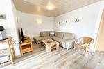 Blick auf Sitzecke in Wohnzimmer in Ferienwohnung in Loddin auf Usedom - Ferienwohnung kleine Auszeit - Top-Hundeurlaub