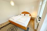 Blick auf Bett in Ferienwohnung in Loddin auf Usedom - Ferienwohnung kleine Auszeit - Top-Hundeurlaub