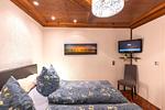 Schlafzimmer - Ferienwohnung Am Kreidebach - zentral in Sagard - Top-Hundeurlaub