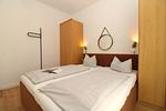 Schlafzimmer - Appartementhaus Meeresblick Fewo E.11 (rolli-freundlich) - Top-Hundeurlaub