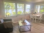 Wohnzimmer mit Seeblick im Schwedenhaus am Ullvettern - Schwedenhaus am See - Top-Hundeurlaub