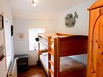 Schlafzimmer mit Stockbett in der Ferienwohnung Hopelfask in Süddorf auf Amrum - Ferienwohnung *Hopelfask* - Top-Hundeurlaub