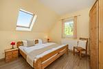 Schlafzimmer - Ferienhaus See Idyll 2 mit Kamin, Terrasse und 2 Bädern - Top-Hundeurlaub