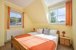 Schlafzimmer - Ferienhaus See Idyll 2 mit Kamin, Terrasse und 2 Bädern - Top-Hundeurlaub