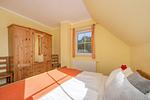 Schlafzimmer - Ferienhaus See Idyll 2 mit Kamin, Terrasse und 2 Bädern - Top-Hundeurlaub