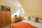 Schlafzimmer - Ferienhaus See Idyll 2 mit Kamin, Terrasse und 2 Bädern - Top-Hundeurlaub