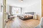 Das erste der beiden Schlafzimmer. - Ferienwohnung Clematis - Top-Hundeurlaub