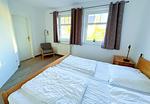 Schlafzimmer - Strandresidenz Juliusruh Fewo 10 - Balkon, 2 SZ - Top-Hundeurlaub