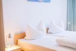 Schlafzimmer - Zwei-Zimmer-Apartment 55/14 - Top-Hundeurlaub
