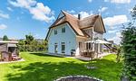 Außenansicht eines Hauses mit Reetdach - Hyggelig Hus - Top-Hundeurlaub