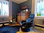 Wohnzimmer mit Kaminofen im Ferienhaus Hus Fee – ideal für Winterurlaub nahe Säfsen - Hus Fee - Top-Hundeurlaub