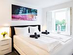 Schlafzimmer 1: Doppelbett (160x200), TV - FeWo GiGi in PRORA mit Meerblick | Balkon - 8.42 - Top-Hundeurlaub