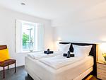 Schlafzimmer 1: Doppelbett (160x200), TV - FeWo GiGi in PRORA mit Meerblick | Balkon - 8.42 - Top-Hundeurlaub