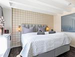 Schlafzimmer 2: Doppelbett (180x200), TV - FeWo Goodlife in PRORA - 7.40 - Top-Hundeurlaub