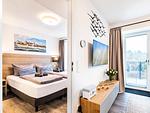 Schlafzimmer 1: Doppelbett (160x200), TV - FeWo Meerzeit in PRORA - 2.42 - Top-Hundeurlaub