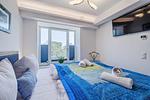 Schlafzimmer: Boxspringdoppelbett (180 x 200), TV, Kleiderschrank, Safe - FeWo Seemelodie in PRORA - 9.43 - Top-Hundeurlaub