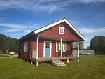 Außenansicht des Log Home in Stöllet – Blockhaus auf Campingplatz in Värmland - Log Home - Top-Hundeurlaub
