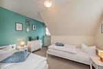Schlafzimmer - Ferienwohnung Strandbrise mit Kamin und Balkon - Top-Hundeurlaub
