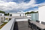 Dachterrasse mit Tisch und Sitzmöglichkeiten - Aparthotel Ostseeallee 5-46 - Top-Hundeurlaub