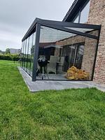 Terrasse mit Glasüberdachung und Grill - Ferienhaus Brandungsperle - Top-Hundeurlaub