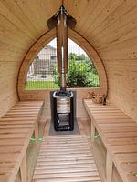 Innenansicht einer Sauna mit Holzofen - Ferienhaus Brandungsperle - Top-Hundeurlaub