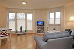 Wohnzimmer mit TV - Wohnung 04 -Promenadendeck - Top-Hundeurlaub