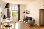 Wohnzimmer - Haus am Park Ferienwohnung 24 - Top-Hundeurlaub