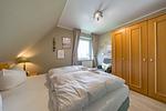 Erstes Schlafzimmer mit Kleiderschrank im sihi217, Hus Inselkieker, Mellumweg 6b in Schillig - Hus Inselkieker 217 - Top-Hundeurlaub