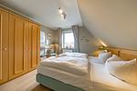 Zweites Schlafzimmer mit Kleiderschrank im sihi217, Hus Inselkieker, Mellumweg 6b in Schillig - Hus Inselkieker 217 - Top-Hundeurlaub