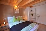 Schlafzimmer - Dominique - Feriendorf Via Claudia Haus 100 - Top-Hundeurlaub
