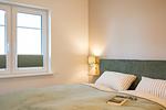 Ferienwohnung Wiese/ Haus Queller in Wittdün/Amrum   Doppelbett mit Leselampe - Wiese - Das Queller - Top-Hundeurlaub