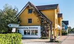 Außenansicht eines gelben Gebäudes - Nathalie - Top-Hundeurlaub